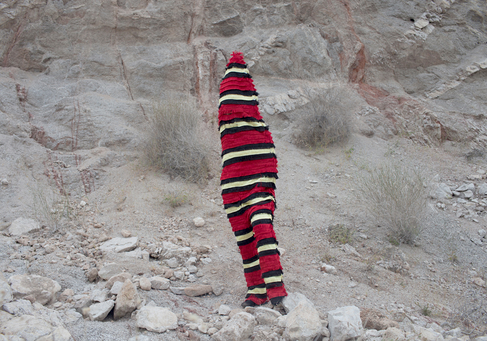 fake coral snake suit by mexican artist Alejandra Aviles