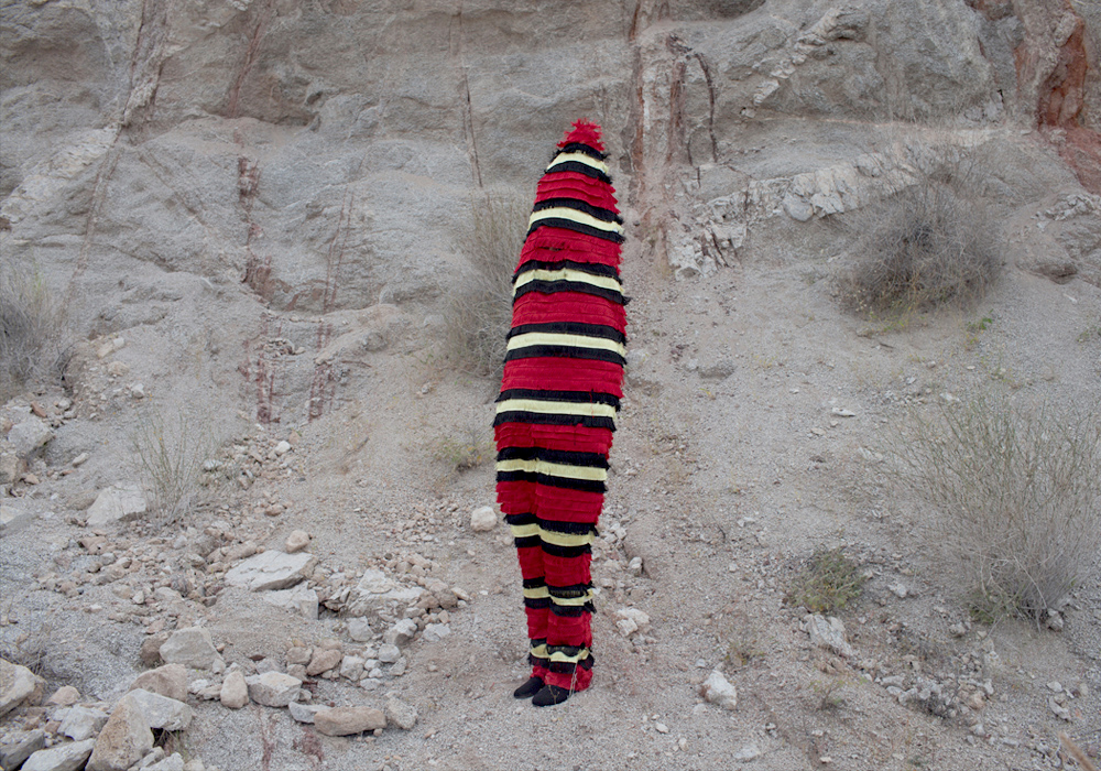 fake coral snake suit by mexican artist Alejandra Aviles
